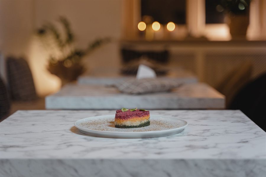 Plated dessert on a marble restaurant table